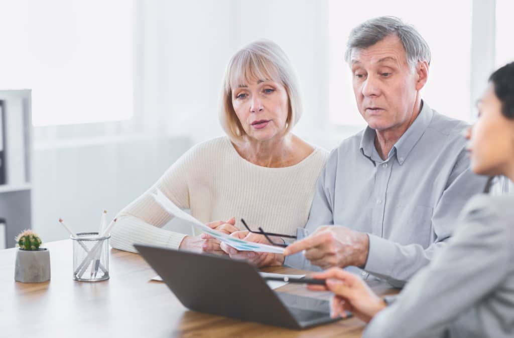 Texas insurance agent explaining increased costs of insurance rates after a car accident.