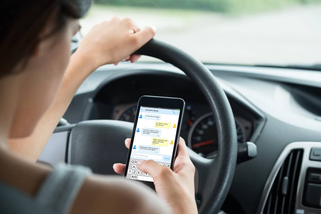Resist the temptation to text and drive on the road.
