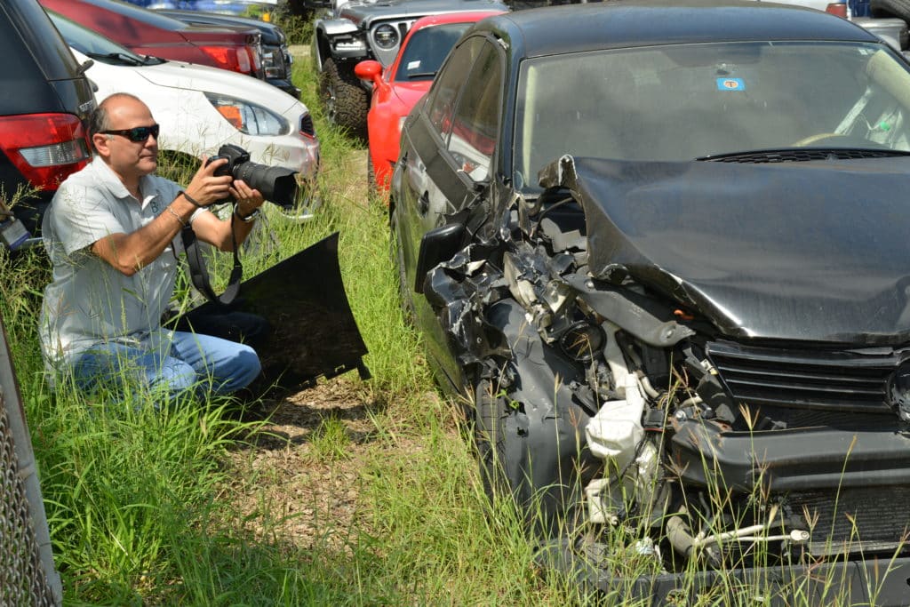 Professional investigator investigating a car accident that may have been caused by a mechanic or repair shop.